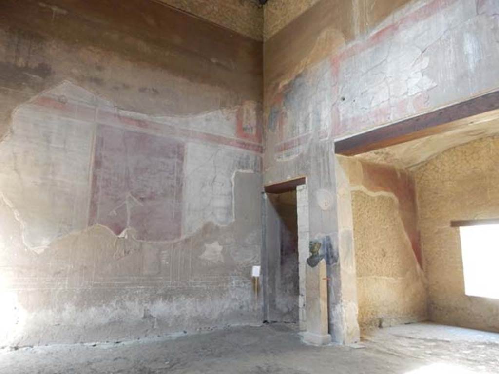 III.16, Herculaneum, May 2018. Room 9, looking towards south wall of atrium, with corridor 6, centre, and tablinum, on right. 
Photo courtesy of Buzz Ferebee